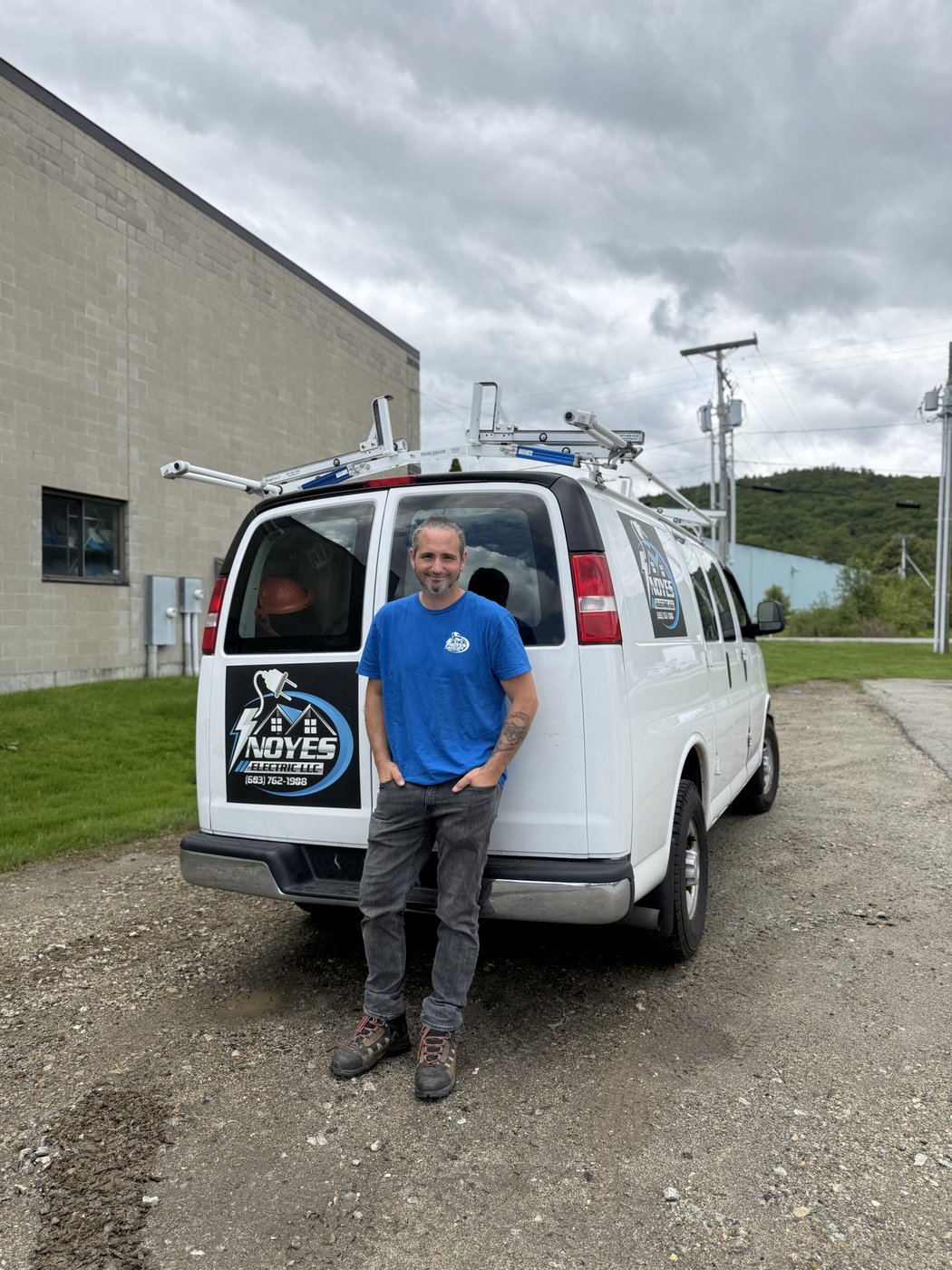 John Noyes, licensed master electrician, with the Noyes Electric van